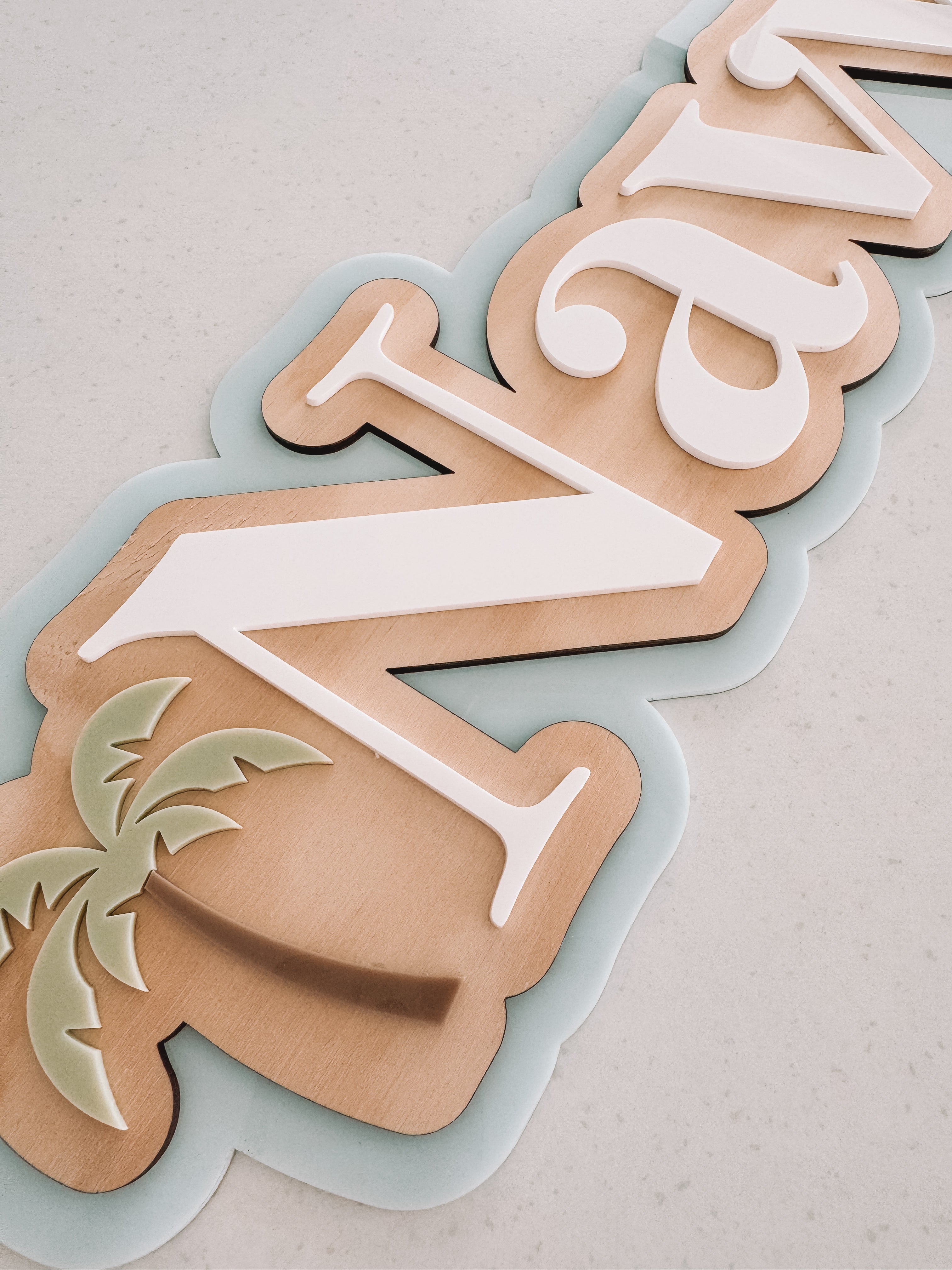 Palm tree triple layer name sign